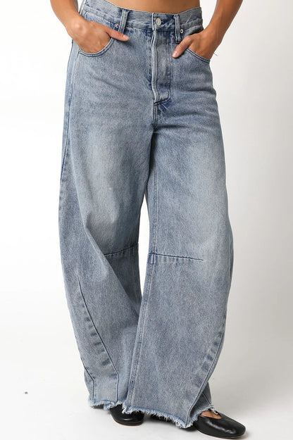 Wide-leg jeans worn by a person on a white background