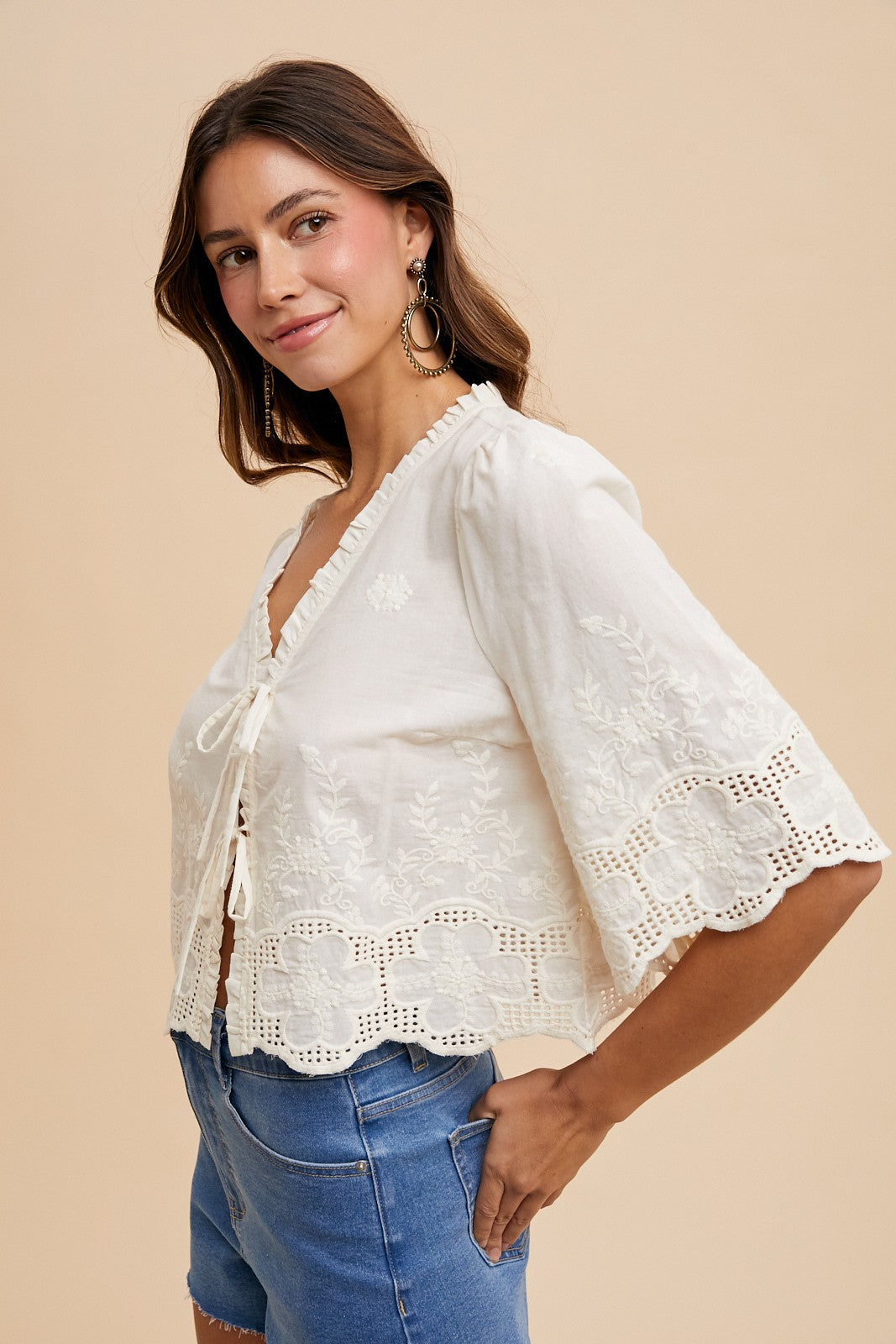 Side view of Willow embroidered blouse showing the relaxed fit and wide flutter sleeve