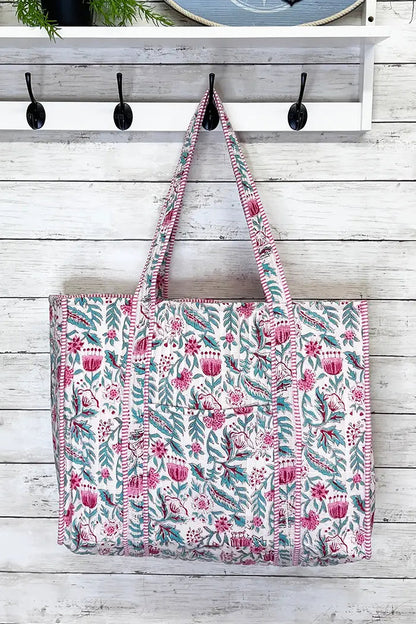 Pink and teal floral print quilted tote bag with long handles and spacious interior