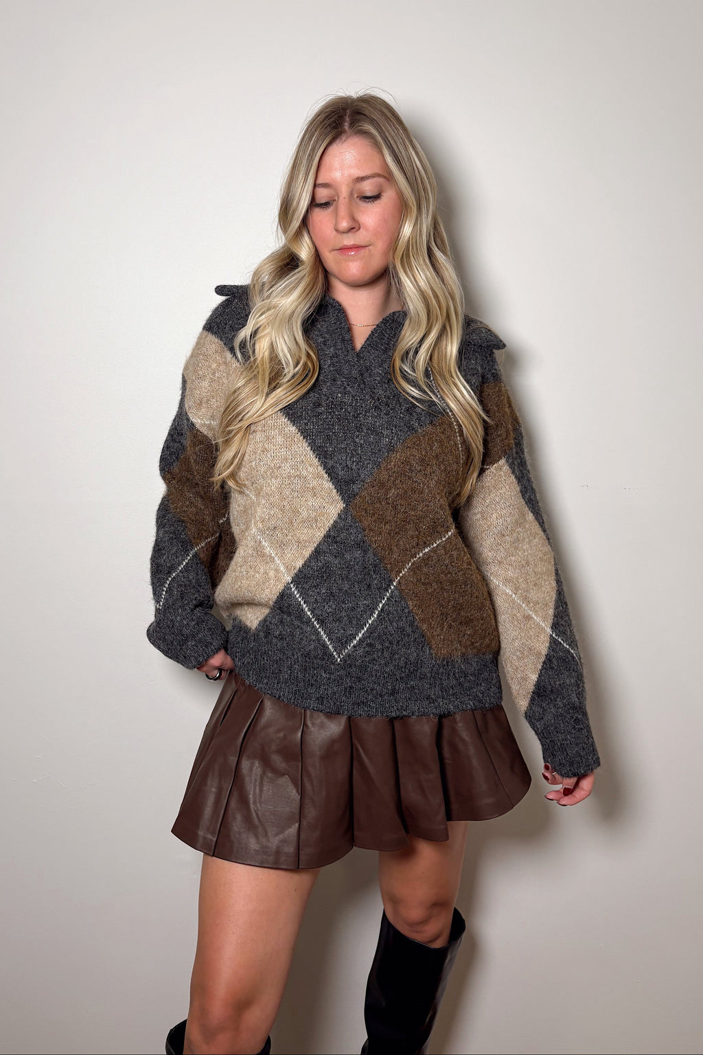 Front view of the Blake argyle knit sweater showing its split V-neckline, oversized collar, and relaxed hem.

