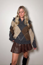 Front view of the Blake argyle knit sweater showing its split V-neckline, oversized collar, and relaxed hem.

