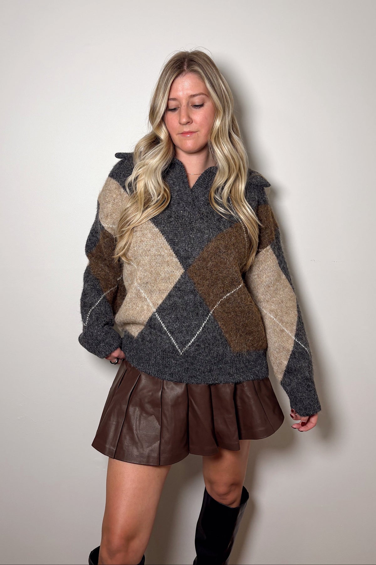 Front view of the Blake argyle knit sweater showing its split V-neckline, oversized collar, and relaxed hem.


