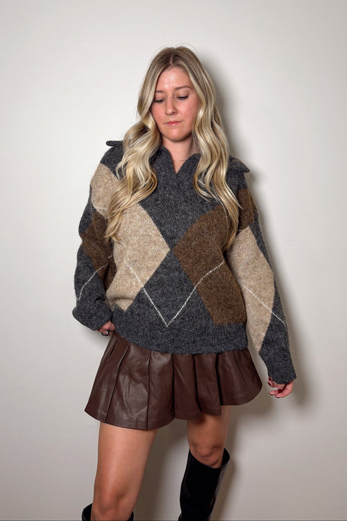 Front view of the Blake argyle knit sweater showing its split V-neckline, oversized collar, and relaxed hem.


