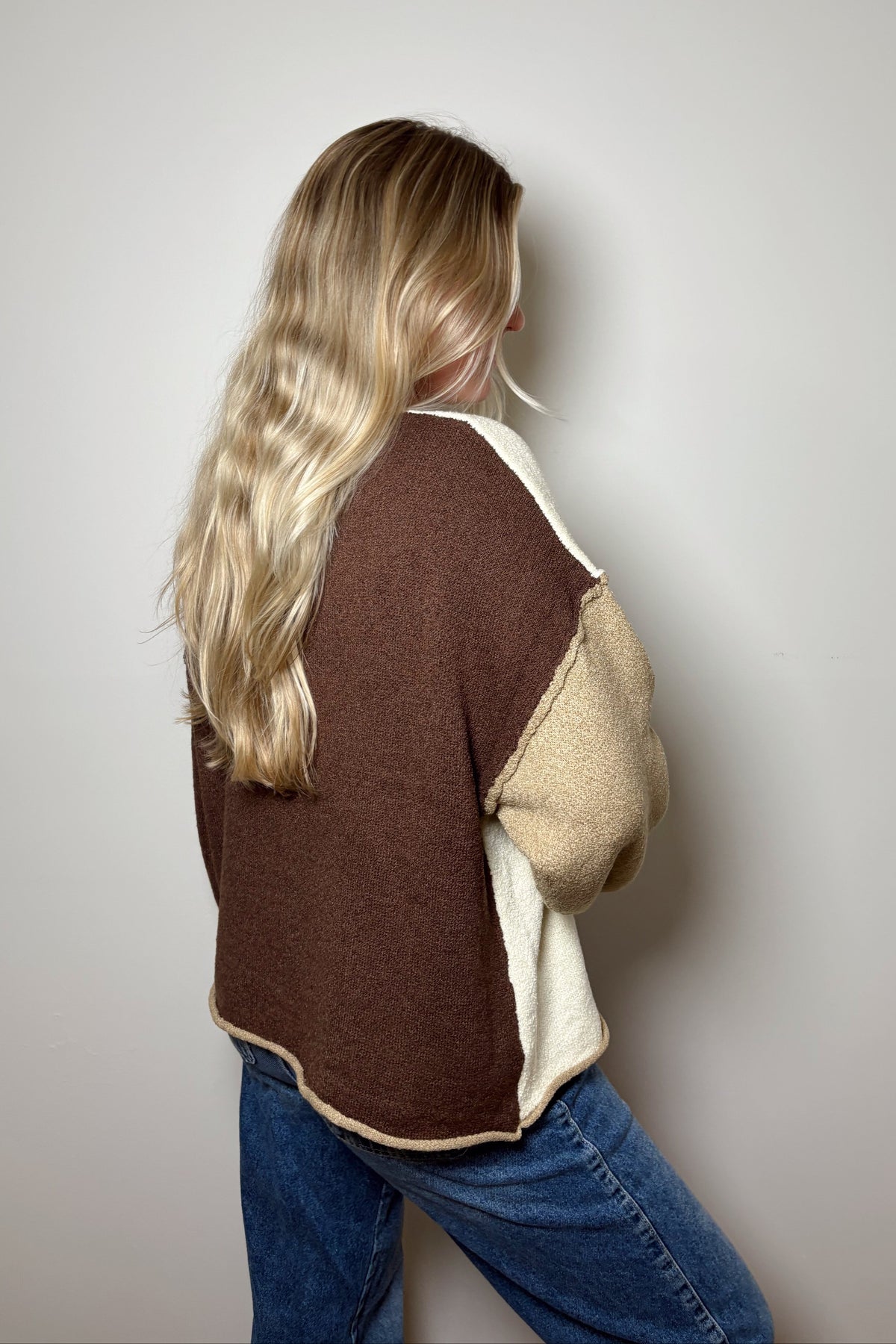 Back view of Brown Sugar sweater showing the chocolate brown panel and exposed shoulder seams