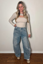 Front view of Ingrid high-rise barrel jeans showing the relaxed leg shape and curved seam details.

