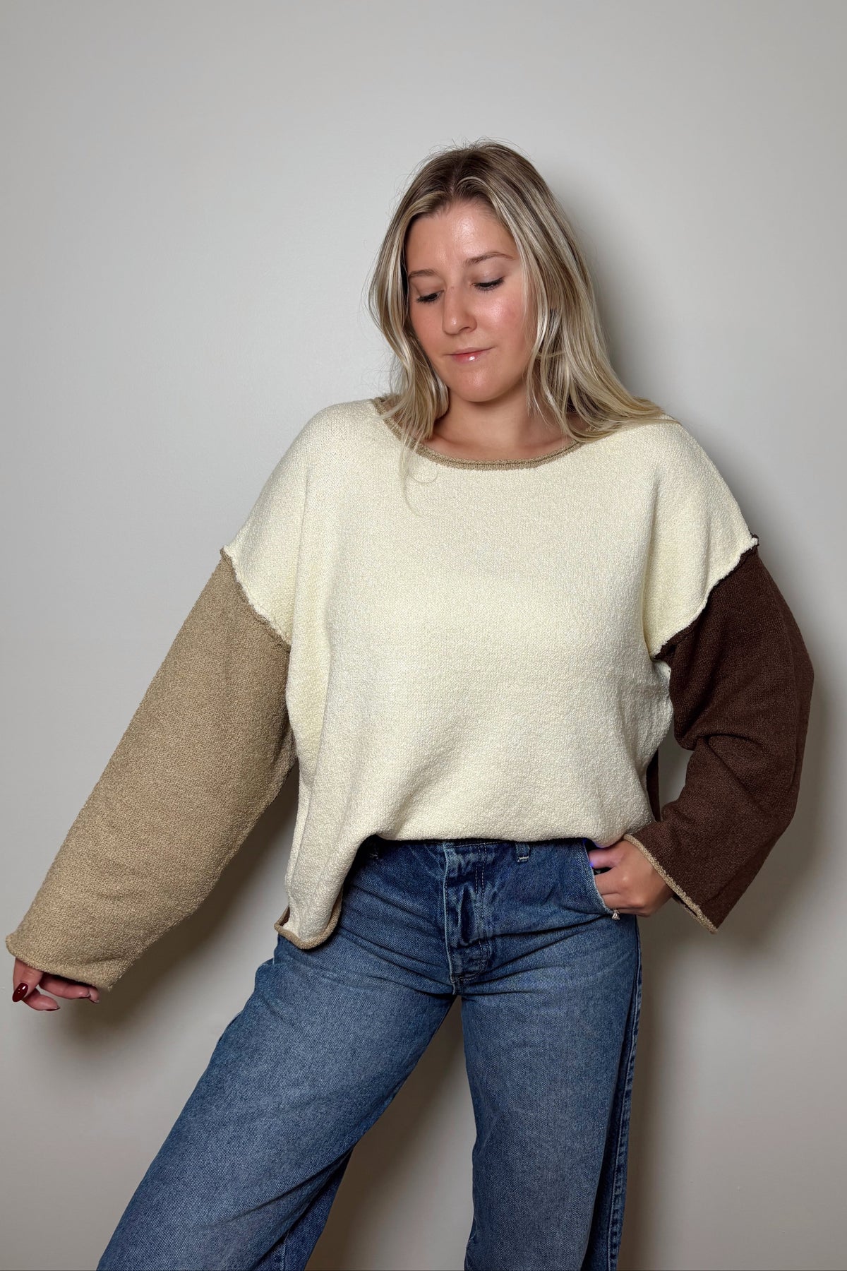 Brown Sugar relaxed knit sweater showing drop shoulders and contrasting neutral sleeves