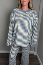 Close-up of the blue Blair lounge set top showing the contrast ribbed crew neckline and striped jersey knit