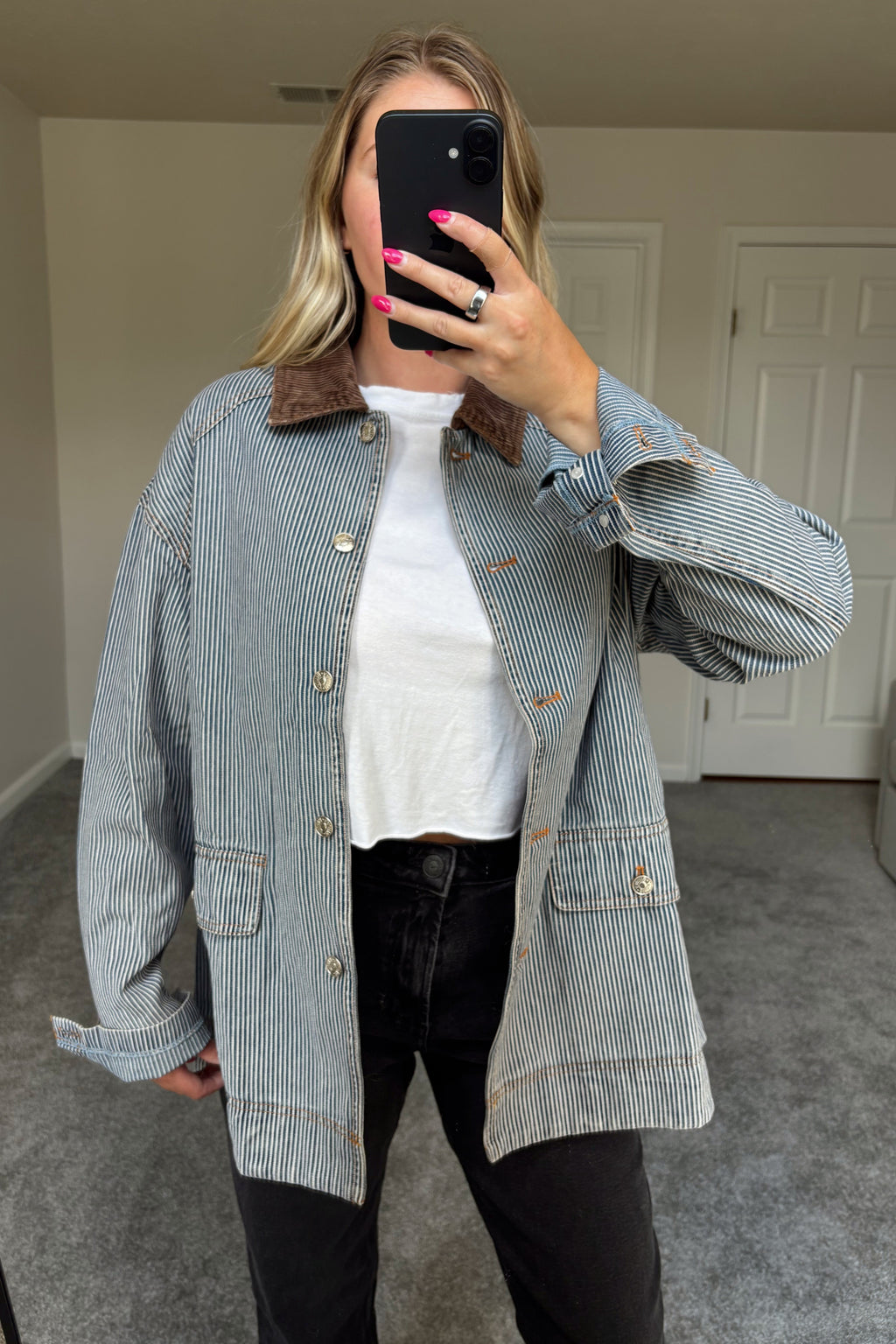 Front mirror view of the Derby barn jacket showing blue-and-white stripes, a brown corduroy collar, metal buttons, and rolled cuffs.

