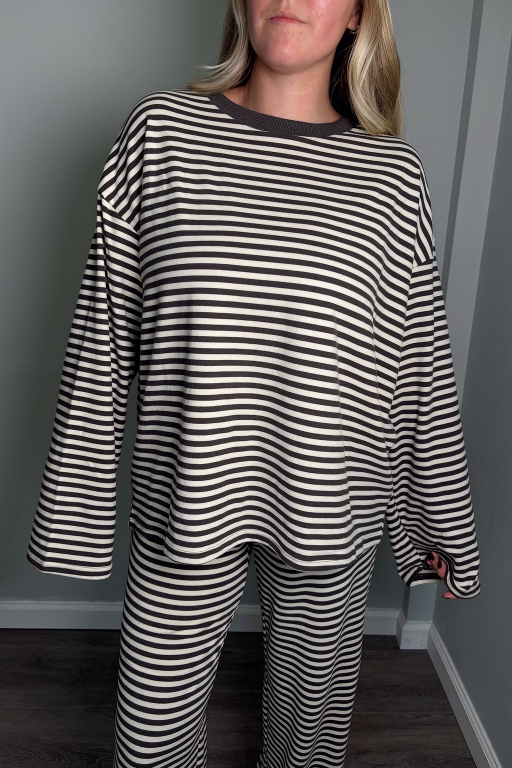 Close-up of the grey and cream Blair lounge set top showing the contrast ribbed crew neckline and striped jersey knit