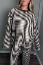 Close-up of the grey and cream Blair lounge set top showing the contrast ribbed crew neckline and striped jersey knit