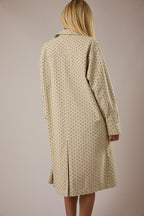 Back view of the Manhattan polka dot trench coat showing the center back slit